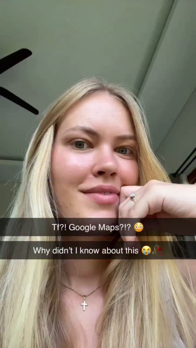 The cover image is a close-up selfie of a woman. She has long blonde hair, and her expression is one of surprise or amusement. The background is softly blurred, suggesting an indoor setting, perhaps near a window due to the lighting. Text overlays are present, including the words "Tf?! Google Maps?!" and "Why didn't I know about this".