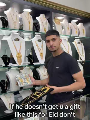 The cover image showcases a man standing in a jewelry store, holding gold jewelry. Behind him are displays of necklaces and other gold items. The text overlay reads: "If he doesn't get u a gift like this for Eid don't".