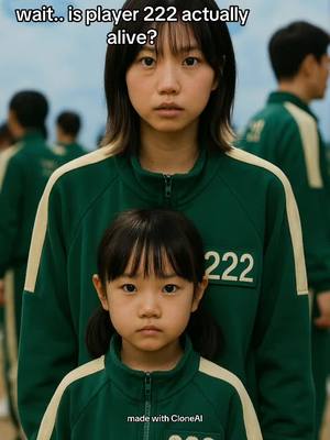 The image features a young woman and a child, both wearing matching green tracksuits from the television show "Squid Game." The woman, identified as player 222, stands in front, with the child in front of her. The woman has black hair and is looking forward with a serious expression. The child with two pigtails looks at the camera with a similar expression. The text overlay at the top says "wait.. is player 222 actually alive?"