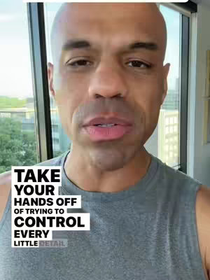 A close-up shot of a bald man looking towards the camera with a serious expression. The man has short, dark eyebrows and slightly parted lips. He is wearing a gray tank top. A white rectangle with bold, black text is in the bottom left corner.