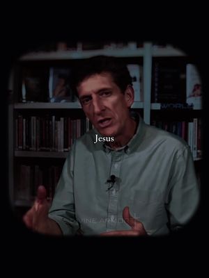 The image presents a middle-aged man speaking directly to the viewer against a backdrop of a bookshelf. The man, dressed in a light green shirt, is gesturing with his hands. Overlayed on the image is the word "Jesus" in white font. The overall composition suggests a discussion or lecture.