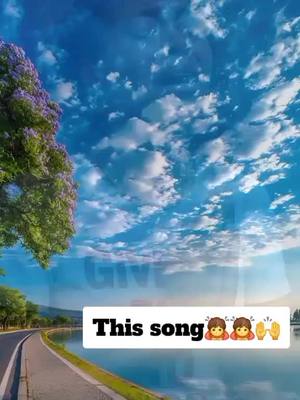 The cover image presents a serene landscape under a bright blue sky dotted with fluffy white clouds. A road and a body of water flank each side of the screen. On the left a large tree and a road. In the forefront, a white rectangle displays playful emojis and bold text.