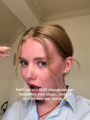 A close-up shot of a young woman with blonde hair, looking directly at the camera. She has rosy cheeks and is slightly opening her mouth. Text overlayed on the image.