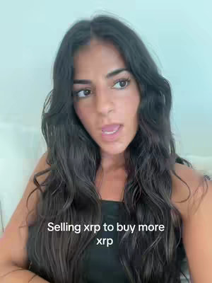 A medium shot features a woman with long, wavy dark hair. She is speaking, her mouth slightly open as she speaks, and has text overlayed at the bottom of the frame.