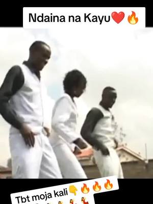 The cover image shows three people, a man and woman in the foreground and a man, all of whom appear to be dancing. They are wearing white formal-style tops and pants, and the background has a neutral tones. The words "Ndaina na  Kayu" in text with a heart and flame are at the top of the cover image as well.