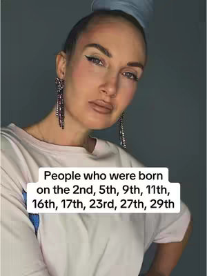 A woman with light skin, wearing dangling earrings, and a bun hairstyle looks towards the camera. Overlaid on the image is a white rectangle containing text.