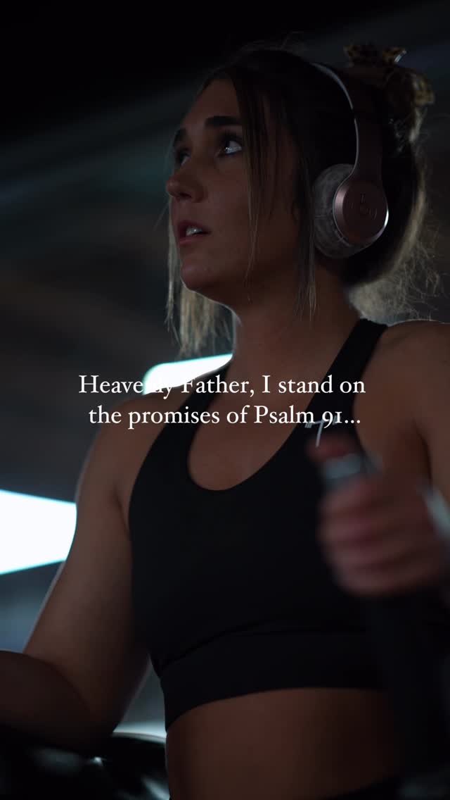 A young woman in athletic attire is shown working out, with text overlayed. She's wearing headphones and appears to be at the gym or a similar setting. The lighting seems to be somewhat dim, but the woman is clearly in focus.