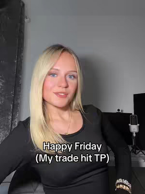 The cover image features a young woman with long blonde hair and blue eyes. She is smiling, wearing a black top, and appears to be indoors, possibly in front of a computer setup. The text overlay reads "Happy Friday (My trade hit TP)".