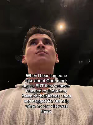 A low-angle shot of a young man looking upwards with a blurred background and text overlayed near the bottom.
