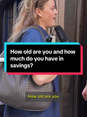 A woman with blonde hair is being interviewed on a street. Text overlays on the image create a question style, with the main question in a large white box. The background is somewhat blurred and consists of an urban environment.