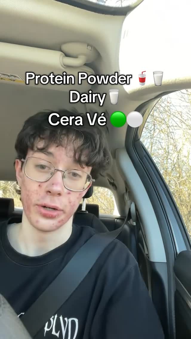 A young man with acne and eyeglasses sits in a car, looking directly at the camera. The image is a selfie-style shot, emphasizing his face and upper body. Text overlay at the top lists the product, followed by emojis of the products. The background is blurred, suggesting the car's interior and the view outside.