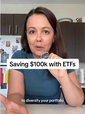 The cover image is a selfie-style shot featuring a woman in a kitchen setting. She is the central figure, positioned in the middle of the frame, with a direct gaze towards the camera. She is wearing a dark teal t-shirt. The background includes a white wall and dark brown cabinets above the woman. The lighting is bright, coming from an unseen source and the woman's hand is slightly raised, holding a mic. A banner is placed across the bottom of the frame reads: "to diversify your portfolio".