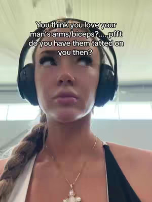 A close-up shot of a young woman with long blonde hair in a braid wearing black headphones. The text overlay is asking a question related to tattoos. The woman is looking up and to the side with a thoughtful expression.