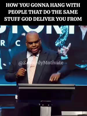 A man in a suit speaks into a microphone at a podium, against a blurred background. Text overlayed in the image states, 'HOW YOU GONNA HANG WITH PEOPLE THAT DO THE SAME STUFF GOD DELIVER YOU FROM'.