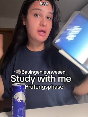 A woman in a dark blue t-shirt is holding an iPad in one hand and has her other hand up to the side. There is a Red Bull can on the table. Text overlays include the time and duration at the top, and the text 'Bauingenieurwesen', 'Study with me', and 'Prüfungsphase', as well as the Red Bull logo.