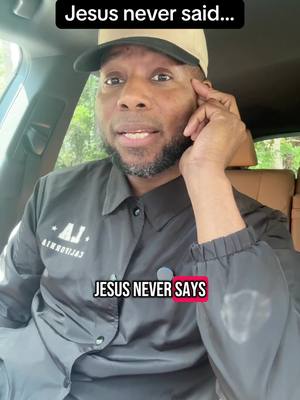 A man sits in a car, speaking to the camera. Text overlays say, "Jesus never said..." at the top and "JESUS NEVER SAYS" in a red box at the bottom. He wears a cap and jacket.