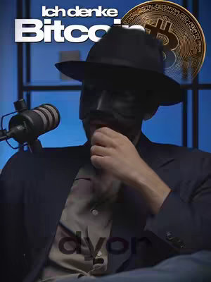 The cover image shows a man in a dark suit, black fedora, and mask over his lower face, with a microphone in front of him. In the background, there is a blue gradient. The text overlay includes 'Ich denke Bitcoin' and 'dyor'. A Bitcoin image is present on the right. Overall, the image has a moody and serious visual tone.