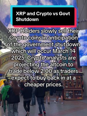 The image shows a crowded outdoor scene, possibly a city street or commercial area, with people walking around. The focus is on text overlays. The main text highlights a potential government shutdown and the impact on XRP cryptocurrency, predicting a price drop to under $2.00. The overall composition is a busy, urban environment.
