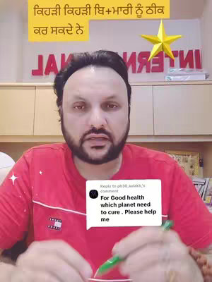 A man with a beard is centered in the frame, looking at the camera. He's wearing a red t-shirt and a necklace. Behind him there's a sign with the word "INTERNATIONAL" and a stylized star with another text in the background. There is a comment overlayed on the bottom of the image.