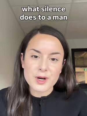 The cover image is a selfie-style shot featuring a woman with dark hair and a black top, centered in the frame. The text overlay reads "what silence does to a man," positioned at the top. The woman is looking towards the camera with her mouth slightly open, suggesting she's speaking. The background appears to be a neutral, possibly office-like environment lit with overhead lighting.
