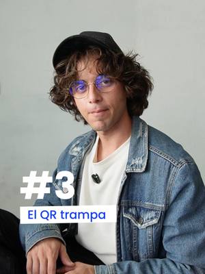 The image shows a young man with curly brown hair wearing a black cap, round eyeglasses, and a denim jacket over a white t-shirt. He is positioned slightly off-center against a light gray background. In the lower-left corner, there is a white rectangle with the number "#3" and the text "EL QR trampa" in bold, black letters.