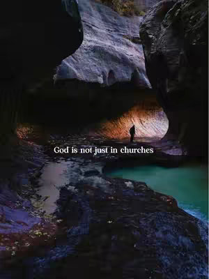 A person stands silhouetted in a cave-like structure, illuminated by sunlight. Moody lighting and a waterfall-like background are visible in the image.