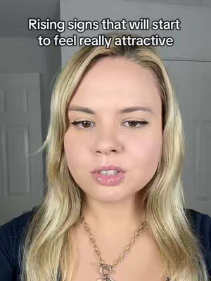 A selfie-style shot featuring a woman with long, blonde hair. She's wearing a dark top and a gold-colored necklace. Overlayed at the top of the image is text in a clean, sans-serif font, reading "Rising signs that will start to feel really attractive".