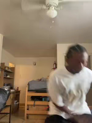 The video cover shows a room interior. A person, partially visible, is the main focus. They are wearing a white shirt.