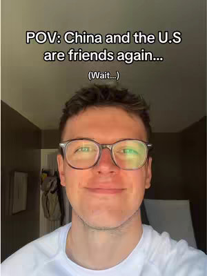 A selfie-style shot of a man with glasses smiling. Above him is overlaid text.
