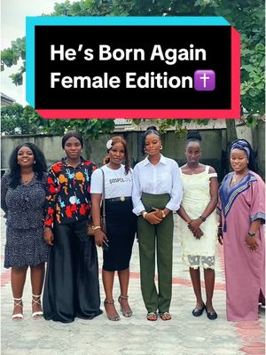 The image shows a group of six women posing in front of what appears to be a concrete wall and some foliage. Above them is a text overlay in a black rectangular box with white text that reads, "He's Born Again Female Edition" with a cross symbol. The women are all dressed in various outfits and stand at varying heights, suggesting a candid or informal photograph. The color palette is natural, with the backdrop of the wall and foliage offering a green and gray contrast to the women's clothes.
