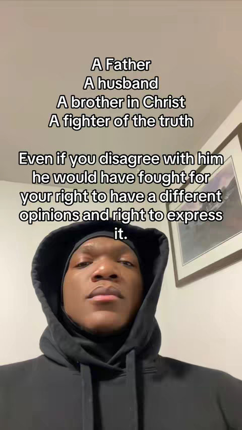 A selfie-style shot featuring a Black man wearing a black hoodie looking directly to the camera with text overlay in white font. The text is a list of descriptive text highlighting the man's personal and social attributes with a motivational tone.