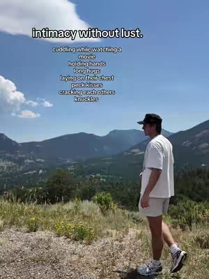 A scenic shot with a man standing on a grassy ridge overlooking a vast landscape of rolling hills and mountains. The text overlay reads 'intimacy without lust.' with a list of intimate actions beneath it. The sky is bright blue with some clouds.