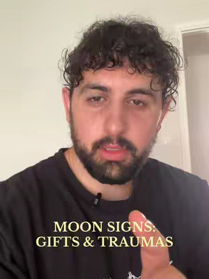A man with curly dark hair and a beard is looking at the camera. The text overlay conveys that the video is about moon signs.