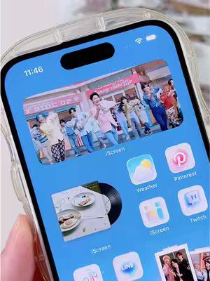 The cover image displays a smartphone screen showcasing a music video playing on the home screen, with app icons arranged below. The phone is encased in a clear, protective case. The background is a light blue color.