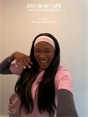 A woman with long black hair wearing a pink scrub top and a pink headband smiles broadly and points her right hand to her left, as if waving. Overlayed text displays a title and additional context. The background is a plain beige wall.