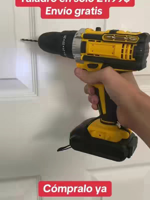 A hand holding a yellow and black power drill, drilling into a white door. Text in red boxes appears at the top and bottom.