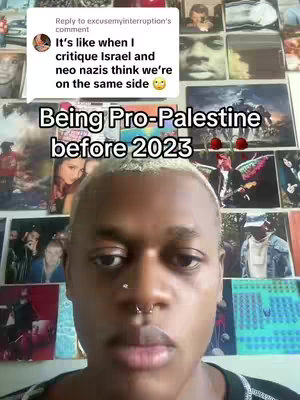 A selfie-style video cover image featuring a person with short, light-colored hair looking directly at the camera. The person has multiple facial piercings and a neutral expression. Behind them is a wall adorned with various images and posters. Text overlays indicate that the video discusses the stance on Palestine before 2023.