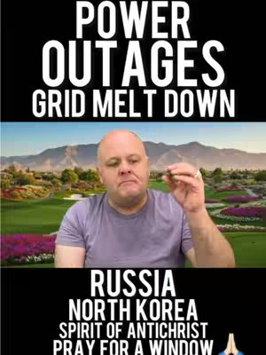 The cover image features a man in a light purple t-shirt posing with a scenic background. The upper portion displays bold white text against a black background: "POWER OUTAGES GRID MELT DOWN." Below the text, a picturesque landscape with a golf course and mountains is visible, with the man in the foreground. The lower portion of the image again uses white text on a black background to read, "RUSSIA, NORTH KOREA, SPIRIT OF ANTICHRIST, PRAY FOR A WINDOW," with praying hands emoji.
