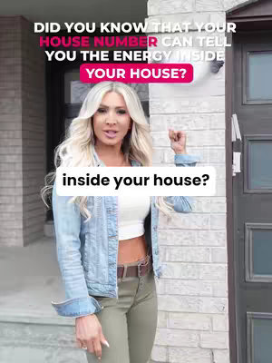 A woman with long blonde hair stands in front of a light-colored brick building doorway. The woman is smiling and gesturing towards the camera. Overlayed text in white and pink is displayed on the image.