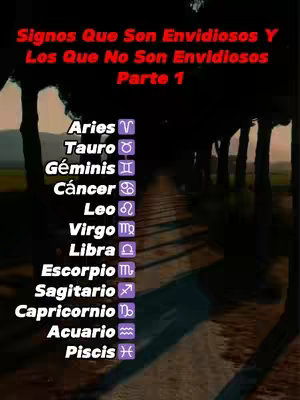 The cover image features a dark, blurred background with a road or path winding through a line of trees, creating a sense of depth. In the foreground, a list of zodiac signs is displayed vertically, each with its corresponding symbol, against the dark background. At the top, the text "Signos Que Son Envidiosos Y Los Que No Son Envidiosos Parte 1" is written in a bold, red font.