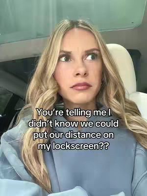 A woman with long blonde hair and wearing a blue top looks off to the side with a contemplative expression. Text overlayed on the image conveys a message about distance in a relationship.