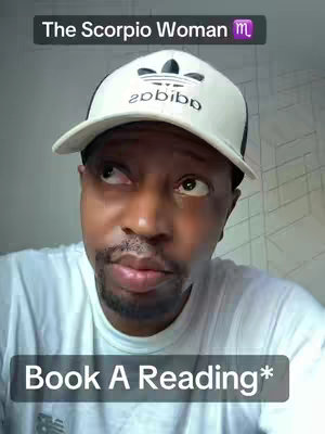 A close-up shot features a Black man with a white Adidas cap looking upwards with a thoughtful or curious expression. The image is well-lit, focusing on his face and upper body with a white, simple shirt, and the Adidas logo is prominent. Text overlays at the top and bottom read 'The Scorpio Woman ♏' and 'Book A Reading*' respectively.