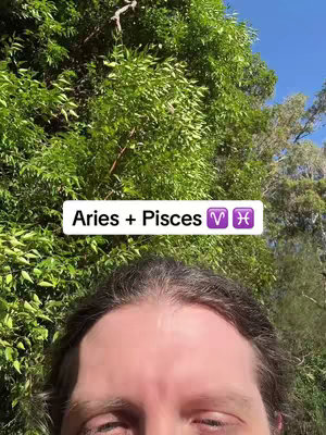 A person's forehead is in the foreground with a white rectangle overlay at the top center that contains text about Aries and Pisces. Behind the person is a vibrant green background of foliage.