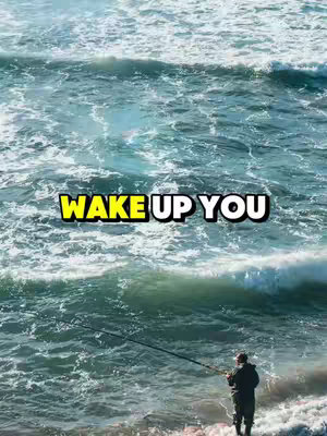 The image captures a scenic view of the ocean with waves crashing in the center. Text overlayed on top with yellow and white colors reading "WAKE UP YOU." A person wearing dark clothing is seen. Their back is towards the camera fishing.
