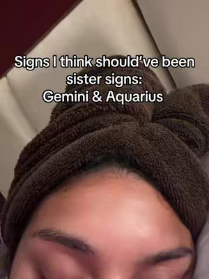 The cover image shows a close-up of a person's face partially obscured by a brown towel wrapped around their head. The person appears to be lying down.  Text overlayed on the image discusses the sister signs in astrology.