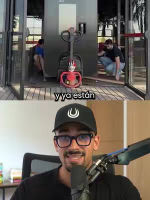 The cover image is split into two sections. The top portion shows a room with glass doors, a robotic drink server in the middle, and two people in the background. The bottom half features a man with a hat and glasses speaking into a microphone.