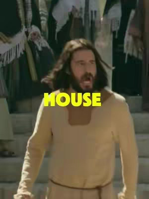 The image shows a man with long hair and a beard, dressed in a light-colored tunic, standing in what appears to be a public setting. The man has an open mouth expression as if he is speaking, while a large yellow text overlay saying 'HOUSE' is prominently placed over his figure.