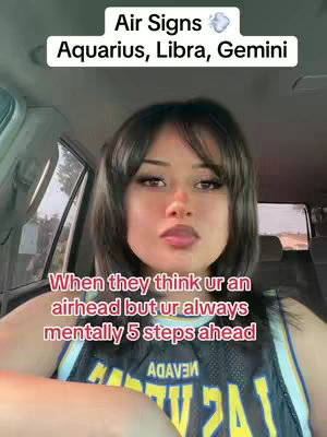 A young woman in a car is the focus, posed with a slight smile. The text overlay says, "Air Signs: Aquarius, Libra, Gemini." Below, more white text states: "When they think ur an airhead but ur always mentally 5 steps ahead."