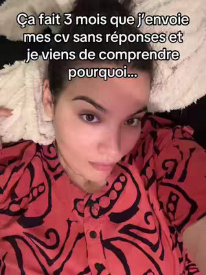 A woman is lying down on a white blanket, looking directly at the camera with a concerned expression. She wears a red patterned shirt. Text overlay is visible at the top.