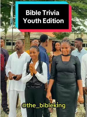 The cover image shows a group of young adults. In the foreground, two women stand out, one in a black dress and the other in a black vest over a white shirt, hands clasped. Behind them, other people are visible, some blurred, with a building and trees in the background. The video title is in a black rectangle with a teal outline on the top part of the image.